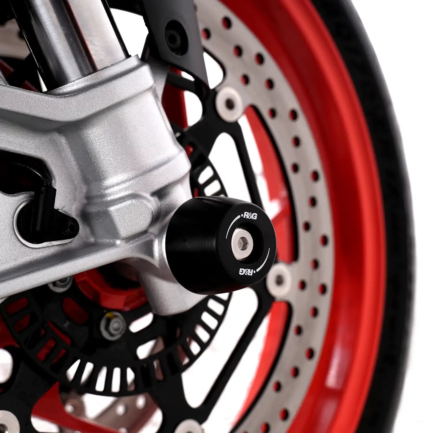 Protector Horquilla R&G APEX vista frontal en Aprilia Tuono 660 protegiendo barras suspension y caliper freno