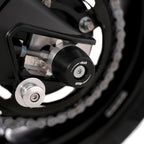 Barra de acero inoxidable pasante eje trasero con bobbins APEX Aprilia RS660