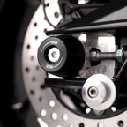 Vista lateral topes de eje R&G APEX en Aprilia Tuono 660 Factory 2025