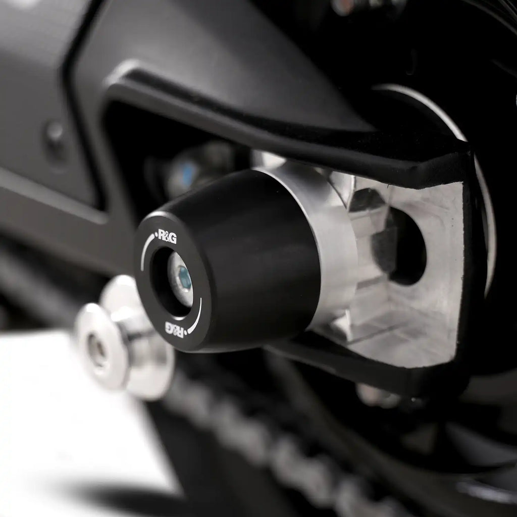 Detalle bobbin cónico APEX negro HDPE en basculante Aprilia RS660 2025