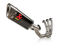 Vista lateral escape Akrapovic carbono Tracer 9 con salida deportiva