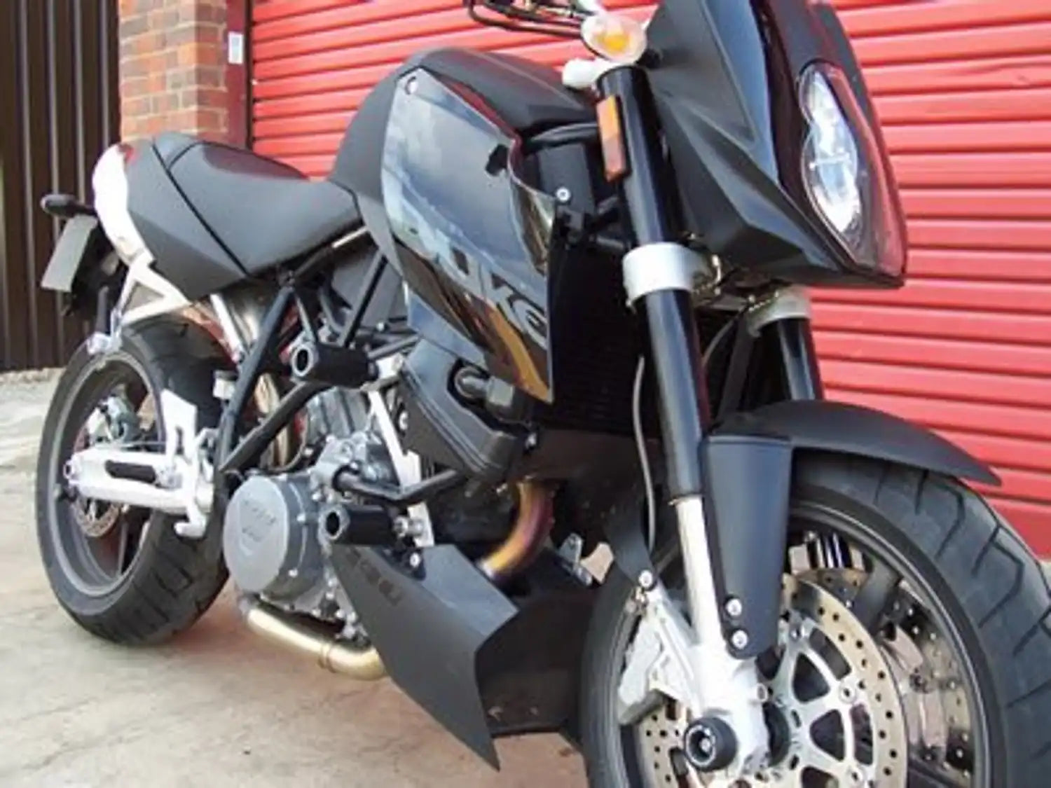 Par de bobinas R&G negras para KTM 950 990 diseño aprobado aseguradoras